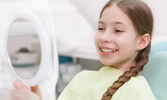 why ortho - young girl at dentist